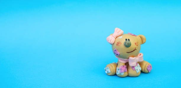istock cute toy figure on blue background 1053928618