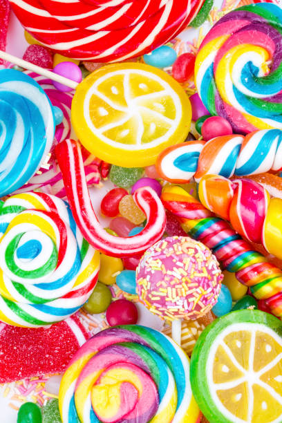 istock Colorful lollipops and different colored round candy. Top view. 1053928628