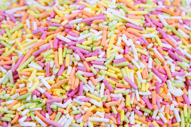 istock Colorful lollipops and different colored round candy. Top view. 1053928716