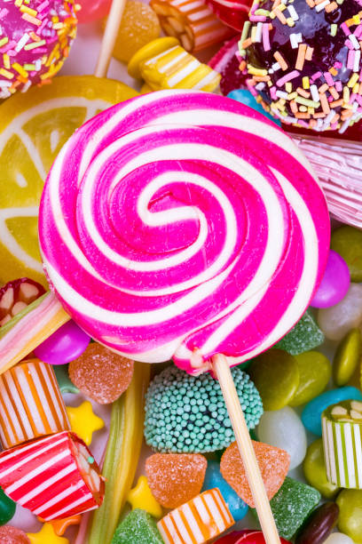 istock Colorful lollipops and different colored round candy. Top view. 1053928746