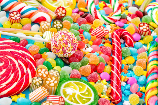 istock Colorful lollipops and different colored round candy. Top view. 1053929040