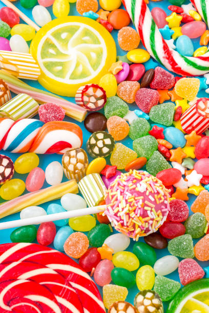 istock Colorful lollipops and different colored round candy. Top view. 1053929916