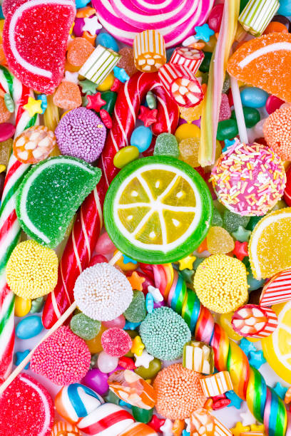 istock Colorful lollipops and different colored round candy. Top view. 1053929970