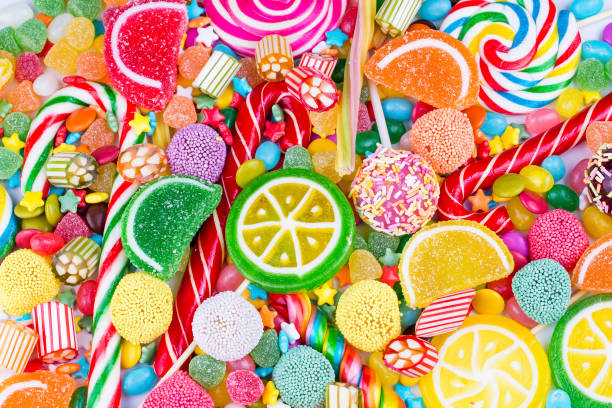 istock Colorful lollipops and different colored round candy. Top view. 1053929976