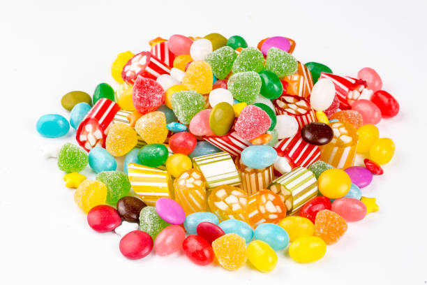 istock Colorful lollipops and different colored round candy. Top view. 1053930074