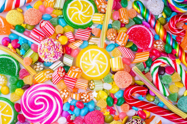 istock Colorful lollipops and different colored round candy. Top view. 1053930122