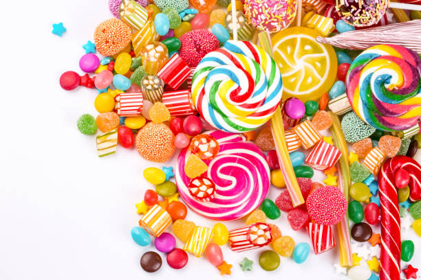 istock Colorful lollipops and different colored round candy. Top view. 1053930258