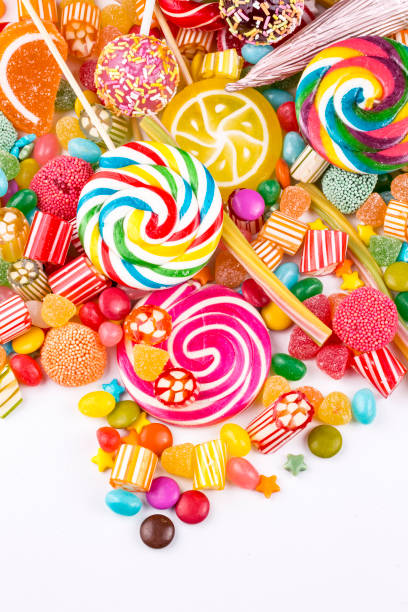 istock Colorful lollipops and different colored round candy. Top view. 1053930300