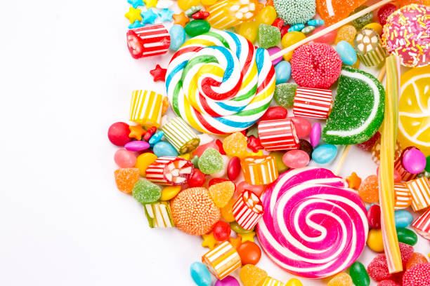 istock Colorful lollipops and different colored round candy. Top view. 1053930302