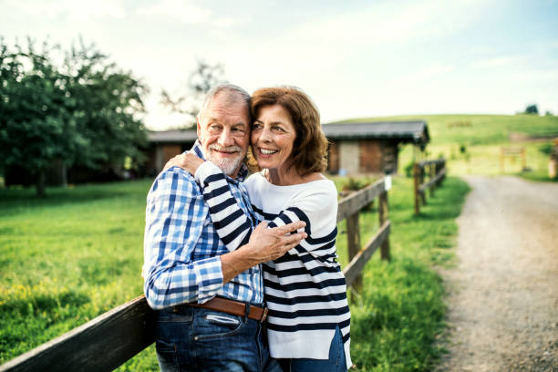 istock A senior couple in love standing outdoors in nature, hugging. 1053930432