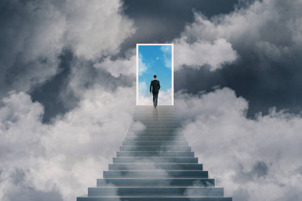 istock win concept with businessman and stairs to sky 1053932524