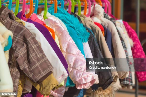 Rack Of Baby And Children Used Dress Clothes Displayed At Outdoor Hanger Market For Sale Stock Photo - Download Image Now