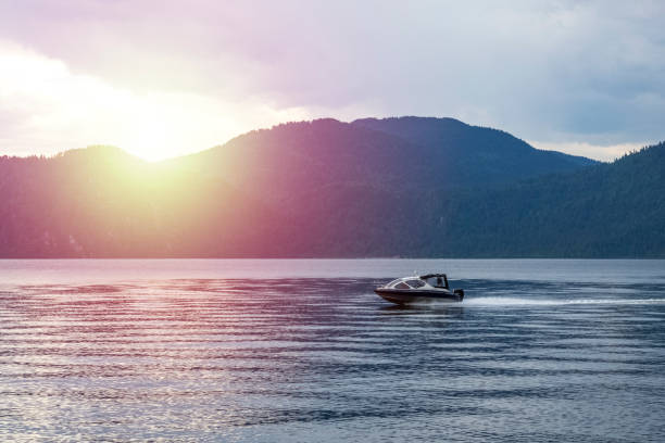 istock Patrol guard on a high-speed motor boat, patrolling the beautiful Teletskoye 1053933092