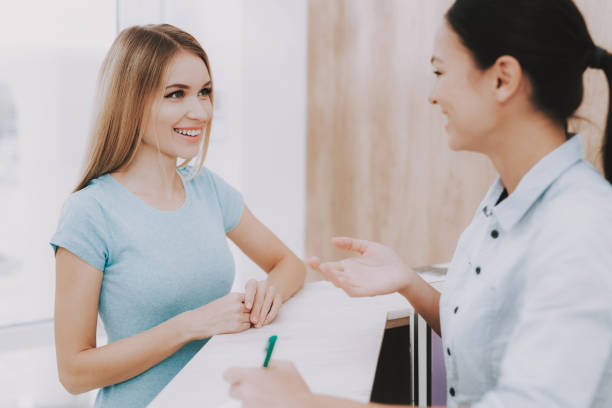 Smiling Employee with Client in Beauty Salon.