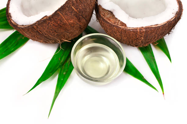 istock Coconut with coconut oil. 1053938550