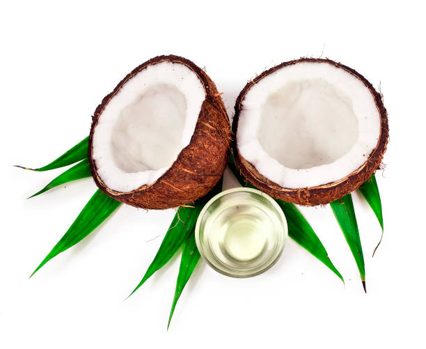 istock Coconut with coconut oil. 1053938620