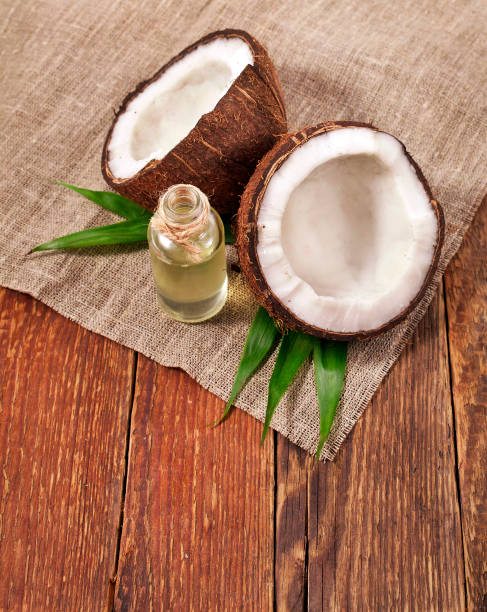 istock Coconut with coconut oil 1053938946