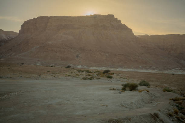 istock Cliff and fortress of Masada 1053940446