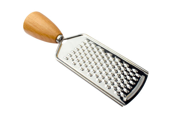 Metal grater with a wooden handle on a white background. Isolated object