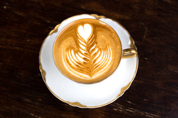 istock Italy: Elegant Cappuccino with Leaf Pattern in Antique Cup 1053946160