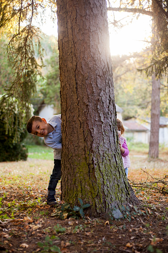 brother and sister playing outdoors