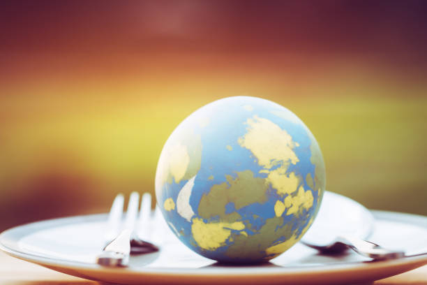 istock Globe model placed on plate with fork spoon for serve menu in famous hotels. International cuisine is practiced around the world often associated with specific region country. World food inter concept 1053952626