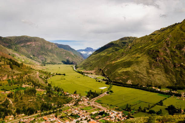 istock Green valleys with some clouds in Valle Sagrado de los Incas, Peru 1053952912