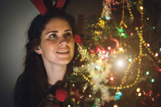istock Cute girl next to a Christmas tree 1053953482