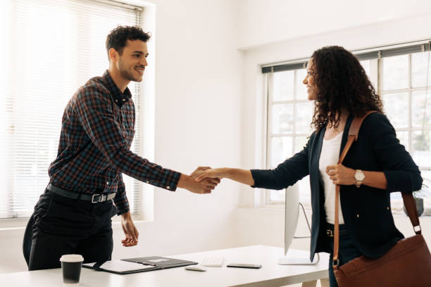 istock Business partners shaking hands after a meeting 1053953800