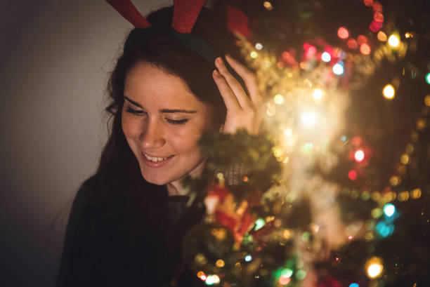 istock Cute girl next to a Christmas tree 1053955034
