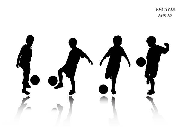 Set of child playing football. Isolated on white background. Soccer players silhouettes of kids collection. Full body of child in sportswear playing football. Different poses. Isolated on white background. Vector illustration. EPS10 boys soccer stock illustrations