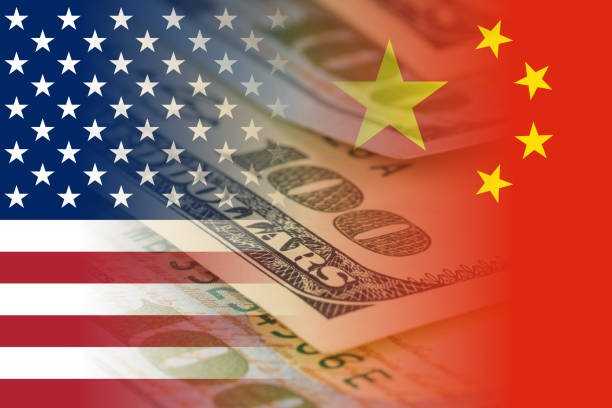 istock united states and china flags with dollars banknotes mixed image 1053957454