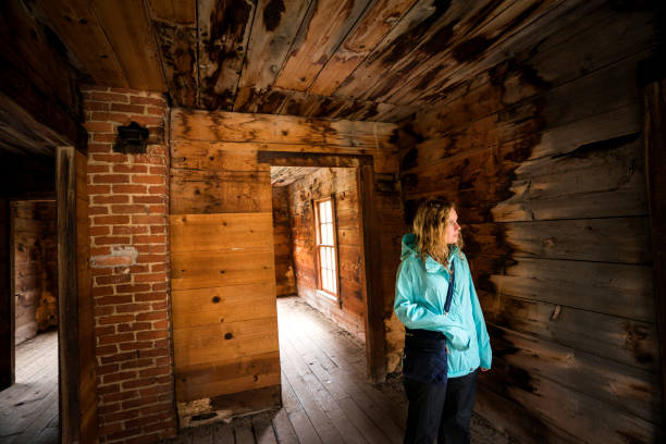 istock Girl visits Duncan house in Animas Forks 1053960912