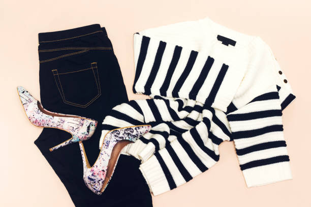 istock black jean, zebra pullover, pair pump shoes  on pink background 1053961428