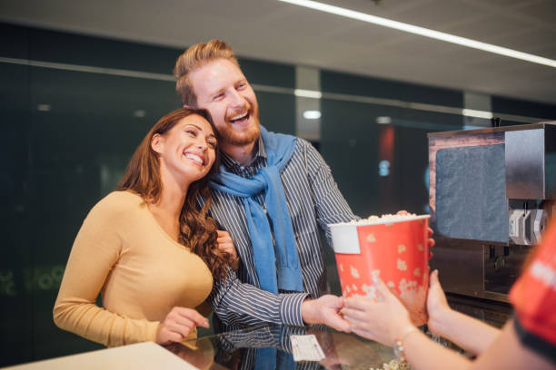 istock Couple buying popcorn at cinema 1053962444