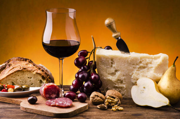 appetizing meal with cheese and fruit and wine