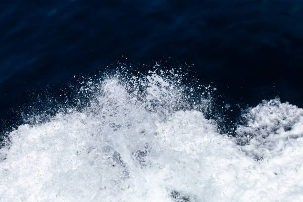istock Blue Seawater with sea foam as background 1053969268