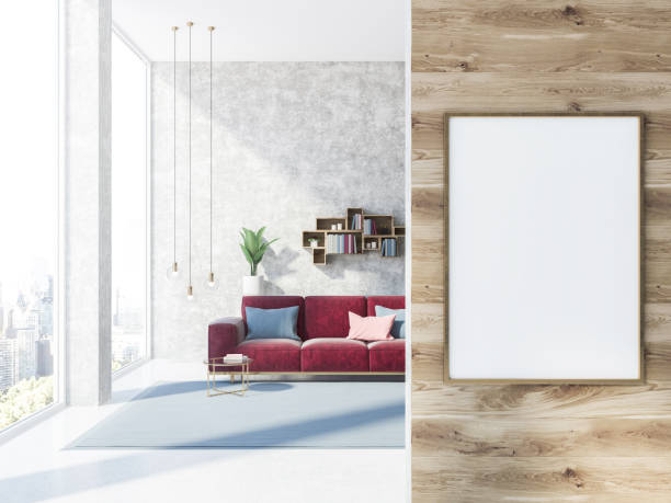 istock Concrete living room with red sofa and poster 1053969598