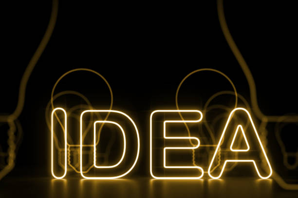 istock Neon yellow idea sign, light bulbs background 1053970610