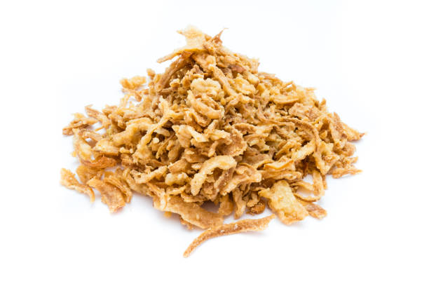 istock Bunch of roasted onions isolated on white background 1053974834