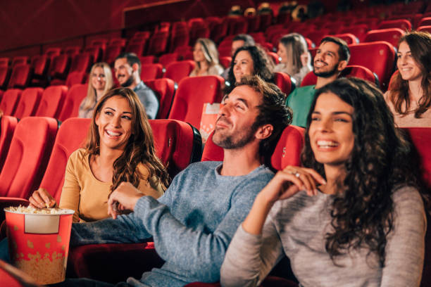 istock Smiling young people at cinema 1053975334
