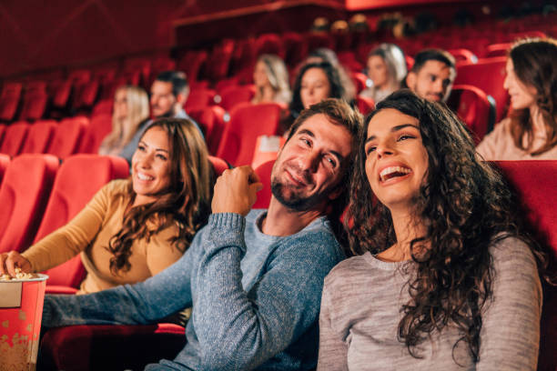 istock Smiling people at cinema 1053975336