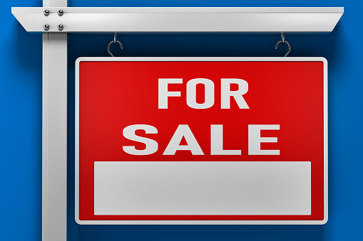 Real estate signage for sale on blue