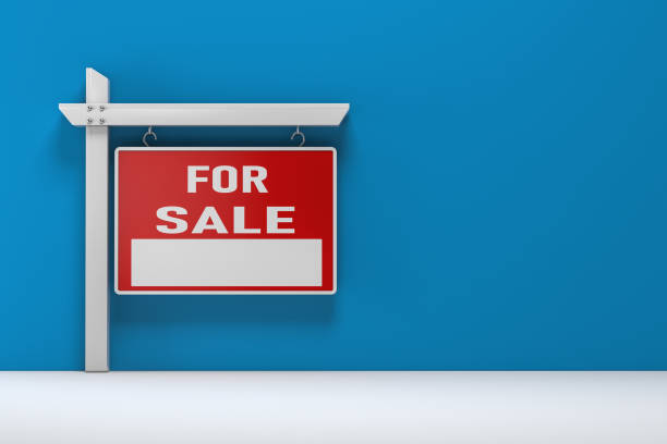 istock Real estate sign on blue- Stock image 1053977362
