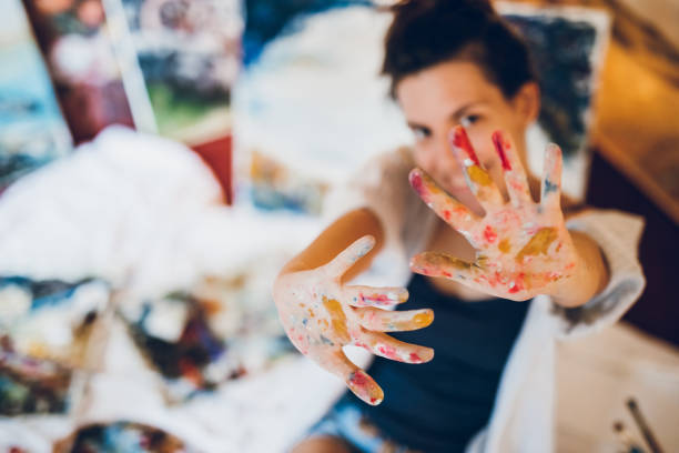 istock Woman painter with her art 1053977638
