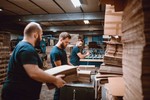 istock Team Work In Cardboard Factory 1053977904