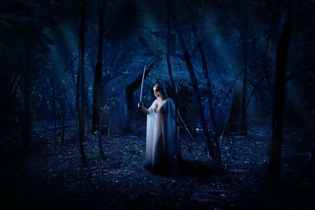 istock Elf girl in night forest version 1053982516