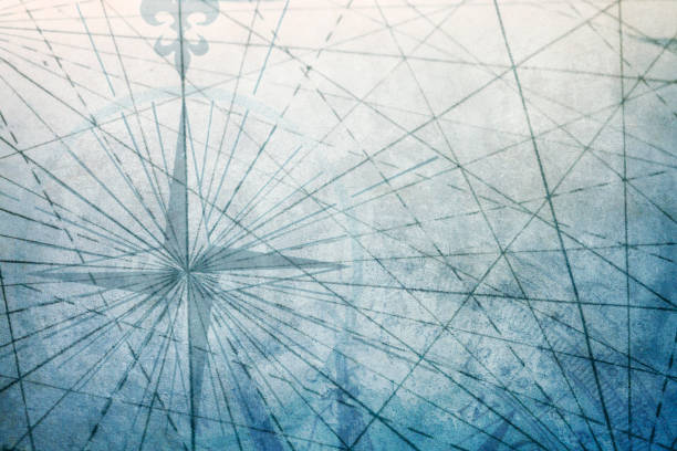 istock Compass Rose On Old World Map With Navigational Lines On Textured Surface 1053985506