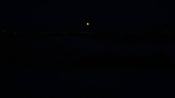 istock full moon and light lanterns in black sky 1053986938