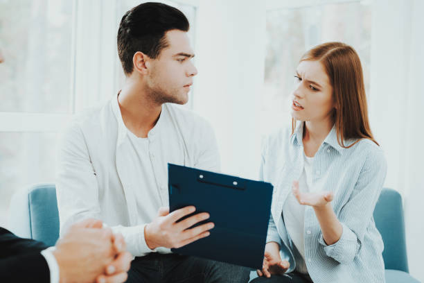 istock Young Couple Meeting With Rieltor. Bright Office. 1053987200